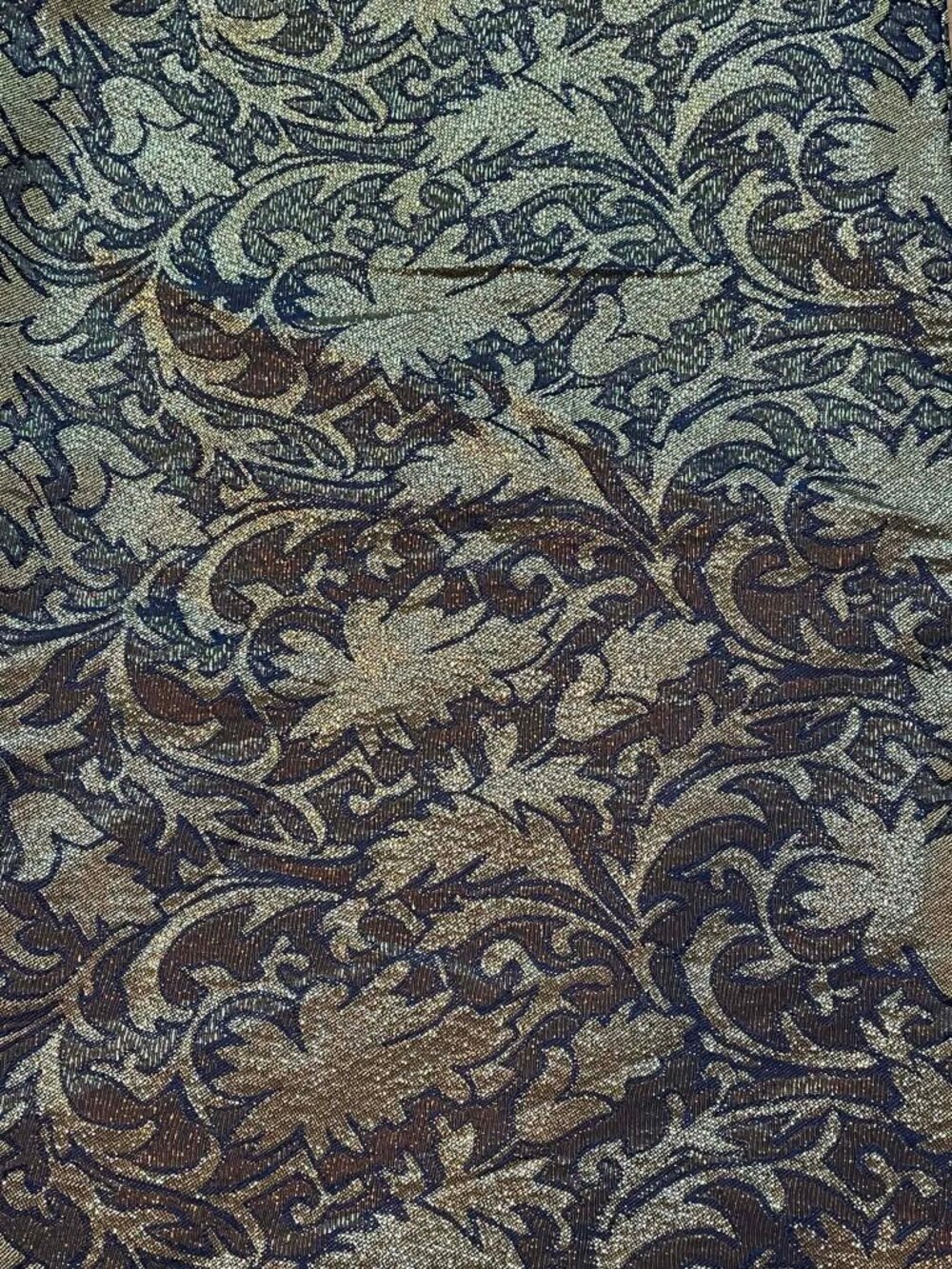 Black and metallic gold brocade fabric.  60" wide.  Sold by the yard.